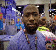 a man with a lanyard around his neck that says ' marathon ' on it