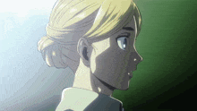 a close up of a woman 's face with a bun
