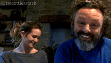 a man with a beard is smiling next to a woman with the words you moot-ivate me below him