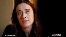 a close up of a woman 's face with #chicagopd on the bottom right