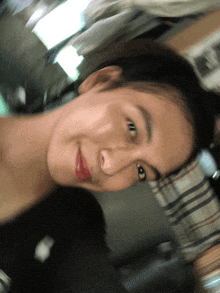 a blurry picture of a woman 's face with a red lip