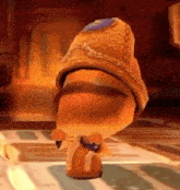 a cartoon character wearing a hat is standing on a tiled floor in a video game .