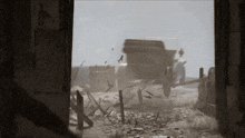 a black and white photo of a car driving through a door