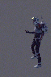 a man in a robot costume is giving a thumbs up