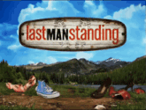 a sign that says lastmanstanding on it with a mountain in the background