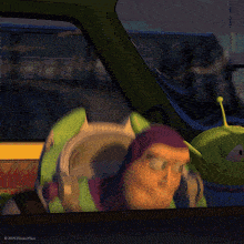 buzz lightyear from toy story is looking out of a window