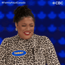 a woman in a leopard print shirt with tammy written on it