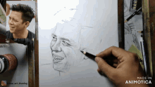 a drawing of a man 's face is being made by animatica