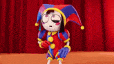 a cartoon character wearing a jester costume is standing in front of a red curtain .