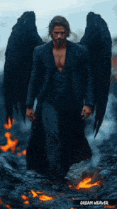 a man with black wings and the name dream weaver written below him