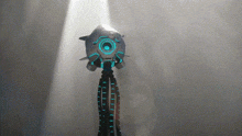 a futuristic looking object with a blue light on it