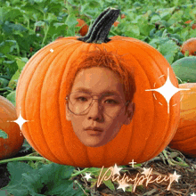 a pumpkin with a man 's face carved into it and the word pumpkin