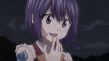 a girl with purple hair and a tattoo on her arm is smiling