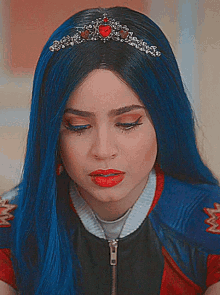 a woman with blue hair is wearing a tiara with a heart on it