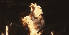 a large explosion with a lot of fire coming out of it .