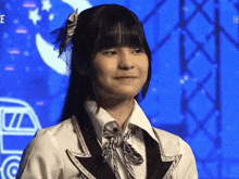 a girl wearing a white shirt and a black and white tie