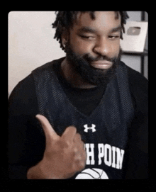 a man with a beard wearing a jersey that says h poin