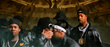 a man wearing a goggles and a hat is holding a piece of paper