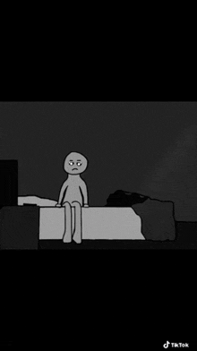 a cartoon character is sitting on a bed in the dark .