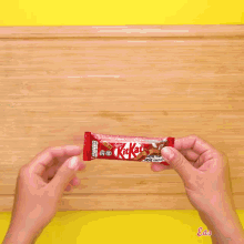 a person is piping frosting into a bag on a piece of wax paper