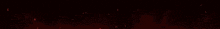 a red light is shining on a black background