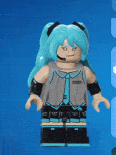a lego figure of hatsune miku is wearing a headset