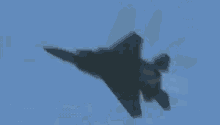 a blurry picture of a fighter jet flying in the sky