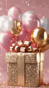 a gift box is surrounded by balloons on a pink background
