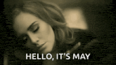 a black and white photo of a woman sleeping with the words `` hello , it 's may '' written next to her .
