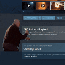 a man is standing in front of a screen that says arc raiders playtest on it