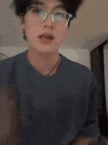 a close up of a person wearing glasses