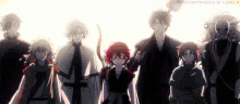 a group of anime characters are standing next to each other in a row .