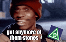 a man wearing a red hat is smiling with the words got anymore of them stones next to him