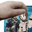 a hand is holding a picture of a clown and a woman .