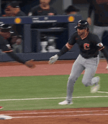 a baseball player with a letter c on his jersey