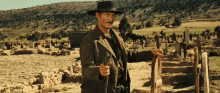 Lee Van Cleef The Good The Bad And The Ugly GIF - Lee Van Cleef The Good The Bad And The Ugly Gun Holster GIFs