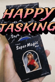 a person is holding a box of super magic man tissue