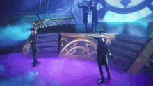 a group of men are standing on a stage in front of a large clock .