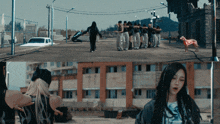 a group of people are standing on a street and a dog is standing nearby
