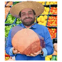 a man wearing a hat is holding a large piece of meat in his hands