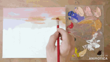a person is painting on a canvas with a brush and the words made in animotica on the bottom