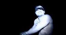 a close up of a person 's shoulder with a light shining on it .