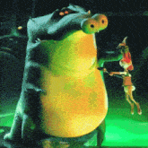 a crocodile with a large belly is standing next to a bunny