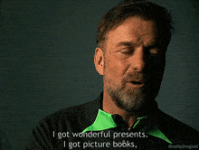 a man with a beard is talking about wonderful presents