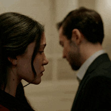 a man and a woman looking at each other