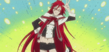a woman with long red hair is giving a peace sign .