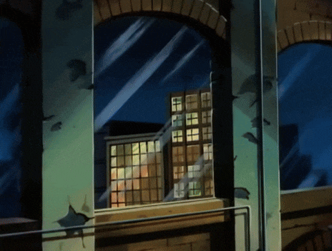 The Green Goblin smashes through a window on his glider, Spider-Man dangling from it by a web