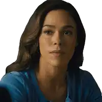 a close up of a woman 's face wearing a blue shirt