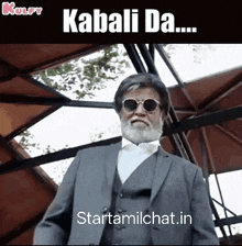 a man with a beard wearing sunglasses and a suit says kabali da
