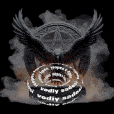 an eagle is surrounded by a ring that says vodiy sados